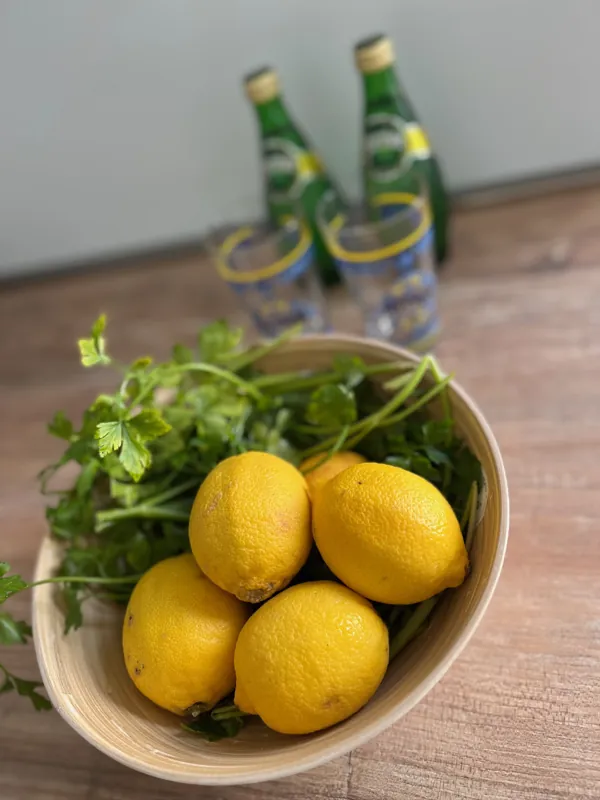 Bowl of lemons and fresh parsley on the kitchen counter